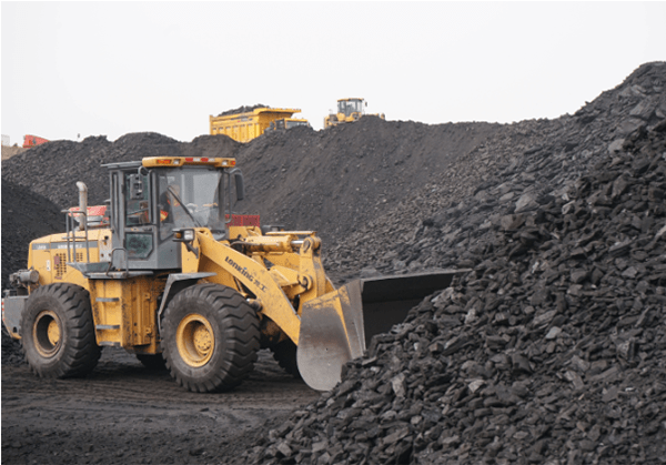a loader is shoveling coal